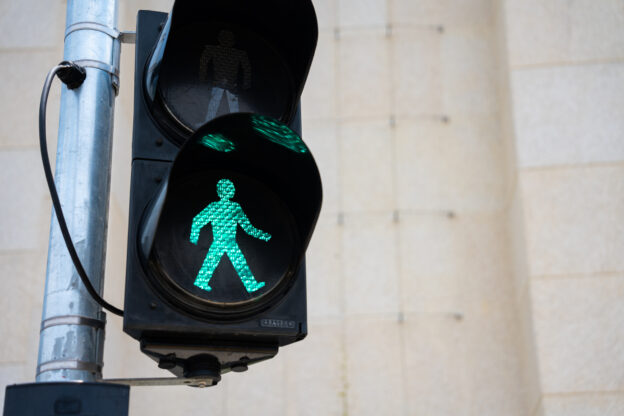 Green pedestrian crossing sign