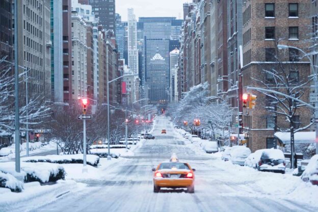 Taxi on snowy city street