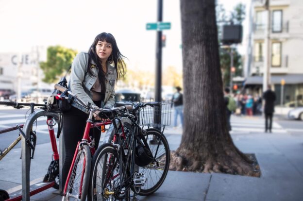 Woman locking her bike outside