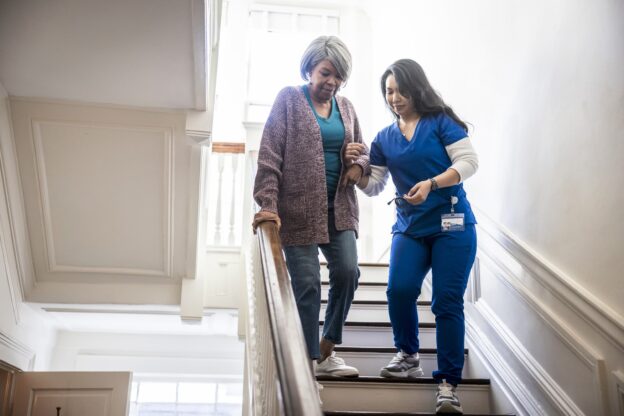 Nurse Helps Patient Walk