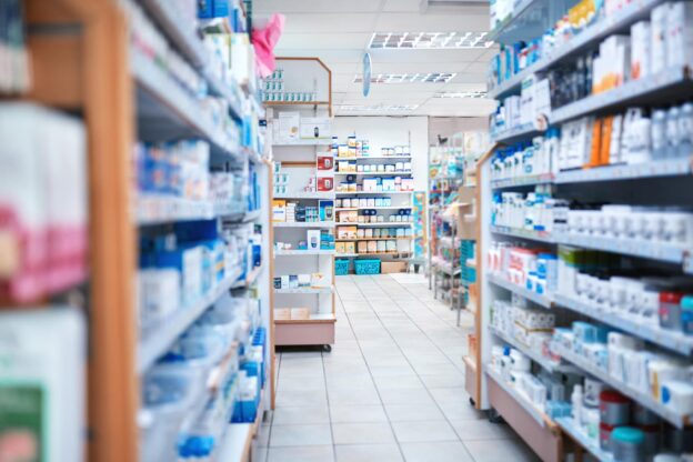 Pharmacy store aisle with medicines and products on the shelves
