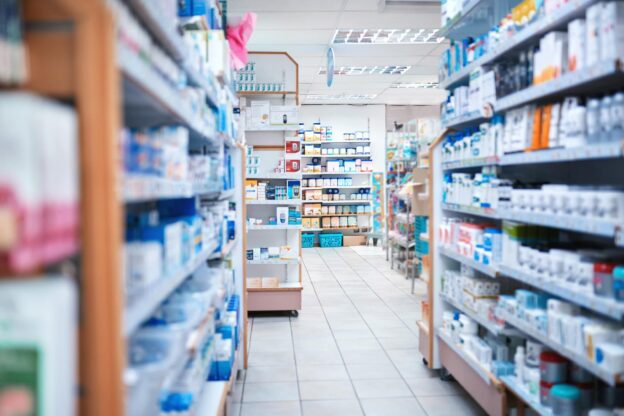 Pharmacy store aisle with medicines and products on the shelves