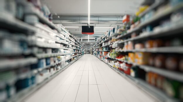 A stocked retail store aisle without people around.