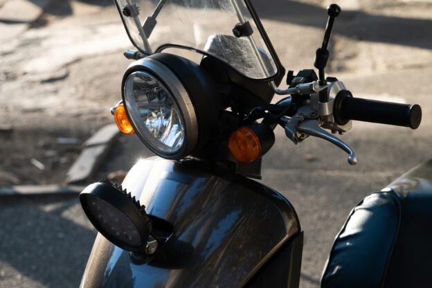 Close up of a small black moped
